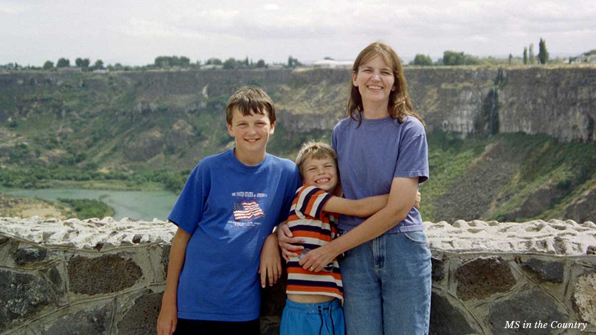 Cathy with her sons during My MS Healing Journey — a peaceful outdoor moment of support and healing.