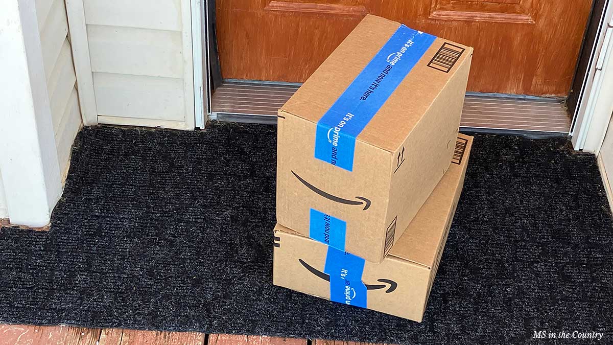 Amazon Prime delivery boxes on doorstep – perfect for Prime Day for MS shopping without leaving home